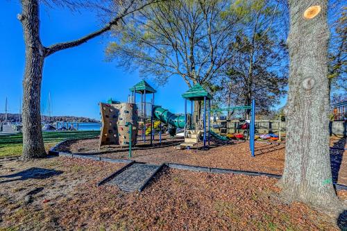 a park with a playground with a slide and trees at The Ship's Bridge in Annapolis