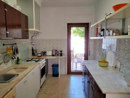 Kuchyň nebo kuchyňský kout v ubytování Casa Laranjeira