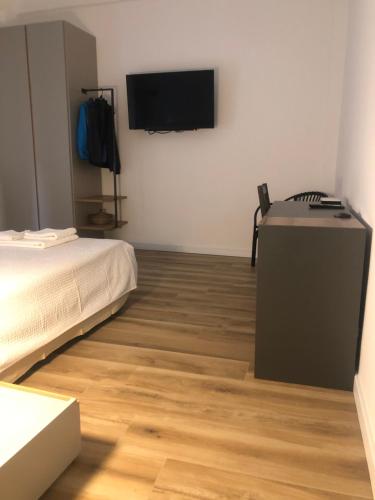 Postel nebo postele na pokoji v ubytování A Due Passi Dalla Scalinata Restyling