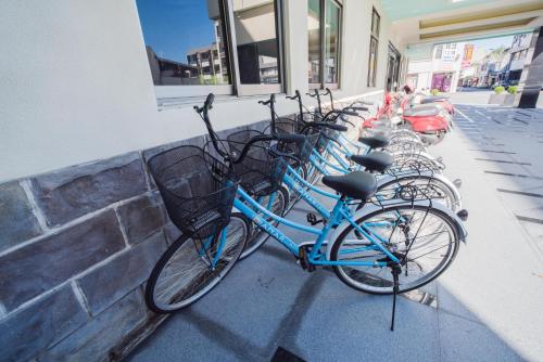 a row of bikes parked next to a wall at Dongdaemun Boutique Hotel in Hualien City