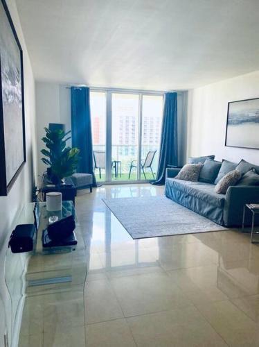 a living room with a couch and a table at Ocean Reserve Piso 9 - STR 2412 in Miami Beach
