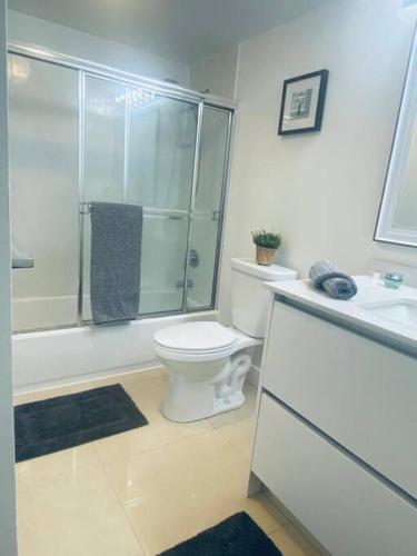 a bathroom with a toilet and a shower and a sink at Ocean Reserve Piso 9 - STR 2412 in Miami Beach