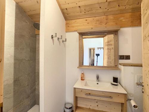 a bathroom with a sink and a shower at Chalet Combloux, 6 pièces, 10 personnes - FR-1-560-71 in Combloux