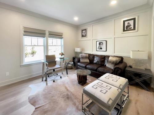 a living room with a couch and a table at New Construction Modern Luxury Retreat w 6 Beds in Southampton