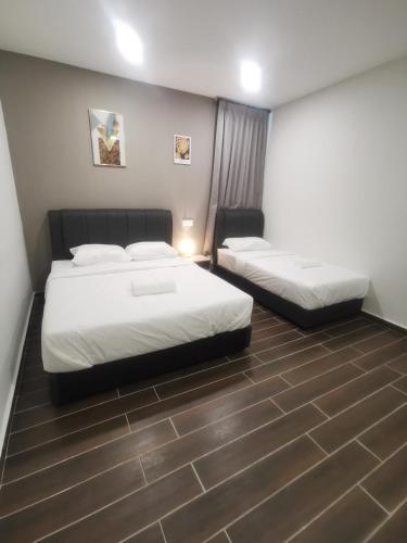 Ένα ή περισσότερα κρεβάτια σε δωμάτιο στο Hotel Mutiara