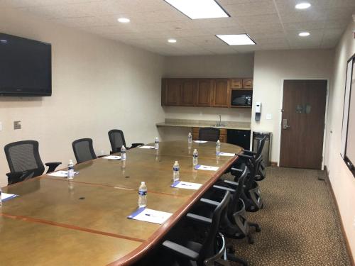 a large conference room with a long table and chairs at Holiday Inn Express Hotel & Suites Howell by IHG in Howell
