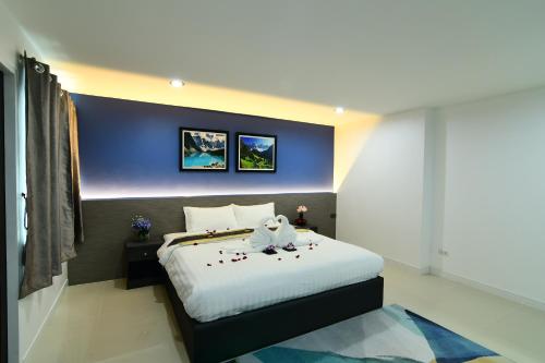 Poonsuk Place Hotelにあるベッド