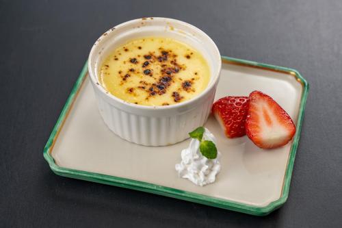 a plate with a cup of food and a strawberry at Ishinoya Izunagaoka - TKP Hotels & Resorts in Izunokuni
