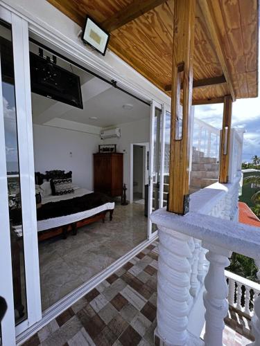 a view of a bedroom with a bed on a balcony at Sunset Paradise in San Andrés