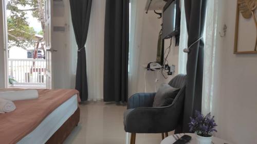 Ένα ή περισσότερα κρεβάτια σε δωμάτιο στο D'LaMar Homestay