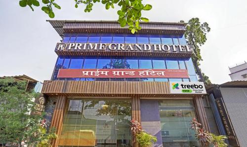 a building with a sign that reads prime grand hotel at Treebo Trend Prime Grand, Andheri in Mumbai