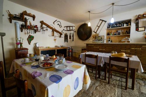 a kitchen with a table with plates of food on it at Biobagnolese Agriturismo in Orte