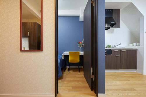 a kitchen and a dining room with a dining table at Cozy Room in東京浅草二階建の一軒家 in Tokyo