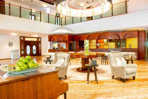 a lobby with a bowl of fruit on a table at EUROPÄISCHER HOF Bad Gastein in Bad Gastein