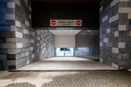 an empty hallway with a sign in a building at Aparthotel Woodside by Anaya in Kopaonik