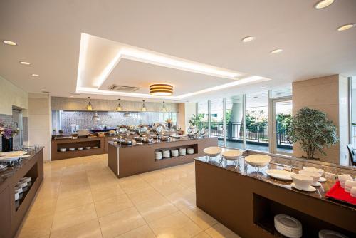 a large kitchen with a lot of food at Bareve Hotel in Seogwipo
