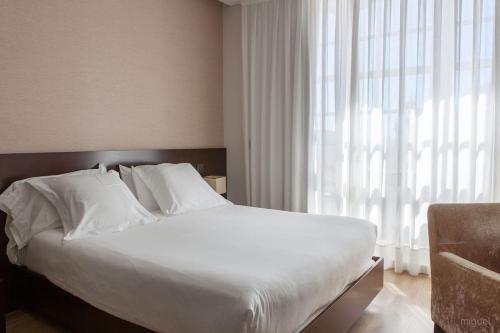 Letto o letti in una camera di Hotel San Miguel