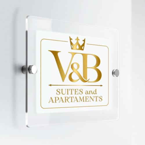 a sign for the ubc suites and apartments with a crown at V&B Suites and Apartments in Pavia