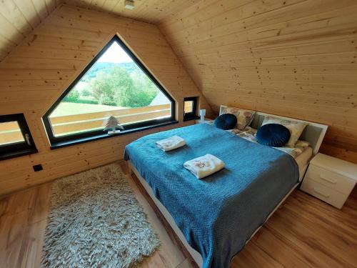 Postel nebo postele na pokoji v ubytování Chatki wisla houses