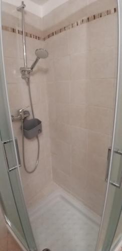 a shower with a shower head in a bathroom at Marianna casa vacanza in Azzate