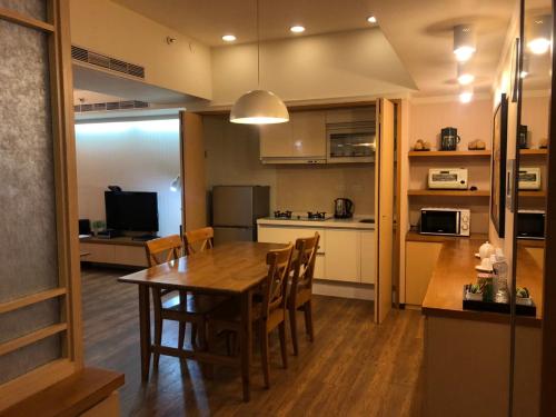 Kuchyň nebo kuchyňský kout v ubytování AJ Residence 安捷國際公寓酒店