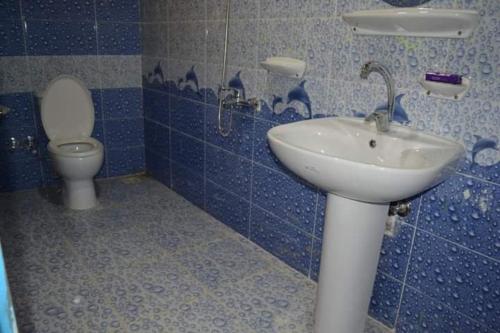 a bathroom with a sink and a toilet at منتجع تونس فاير- Tunis Fire Resort in Tunis