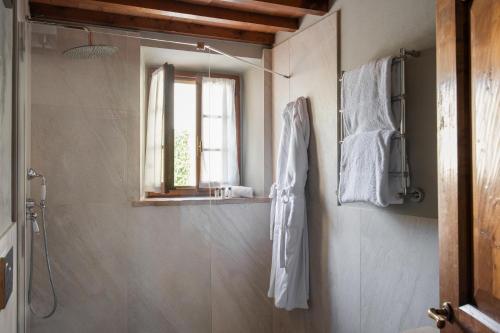 a bathroom with a shower and a mirror at Relais Villa Olmo - Place of Charme in Impruneta