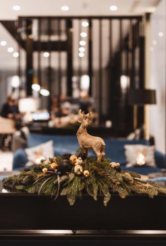 a figurine of a deer sitting on top of a table at Radisson Collection Hotel, Warsaw in Warsaw