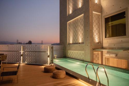 a swimming pool on the roof of a building at The Greenwood Guwahati - A Luxury Boutique Hotel in Guwahati