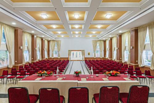 a large conference room with a table and chairs at Sterling V Grand Madurai in Madurai
