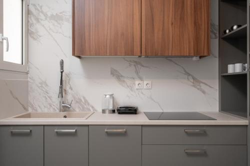 Kuchyňa alebo kuchynka v ubytovaní Deluxe 4 Bedrooms Apartment in Athens Center