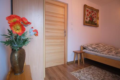 Ένα ή περισσότερα κρεβάτια σε δωμάτιο στο Apartamenty Magiczny Kącik