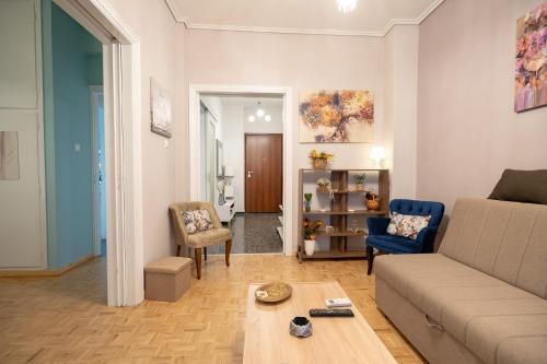 a living room with a couch and a table at Pasalimani 1 bedroom 4 persons apartment in Piraeus