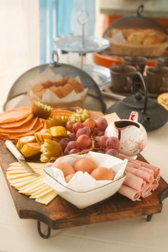 a plate of food with meat and vegetables on a table at Les Jardins de Nicole in La Plaine des Cafres