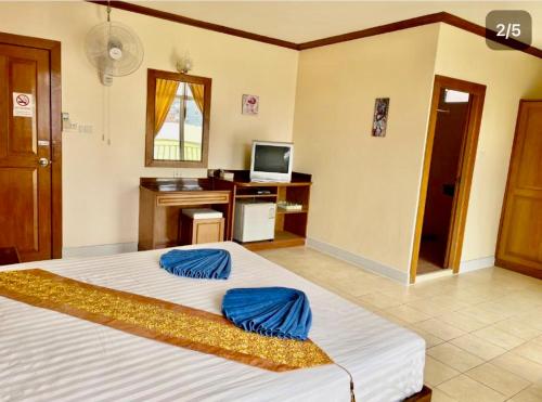 Un ou plusieurs lits dans un hébergement de l'établissement Innarm House Patong