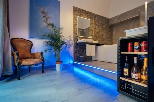 a room with a chair and a bottle of wine at Imperial Rhome Guest House in Rome