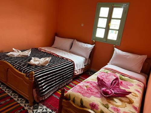Cama o camas de una habitación en Hotel Izlane