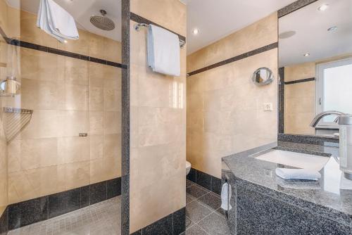 a bathroom with a sink and a shower at Hotel Moosburger Hof in Pfaffenhofen an der Ilm