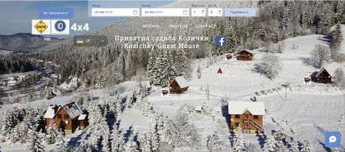 una vista aérea de una estación de esquí en la nieve en Kozichky Guest House en Tatariv