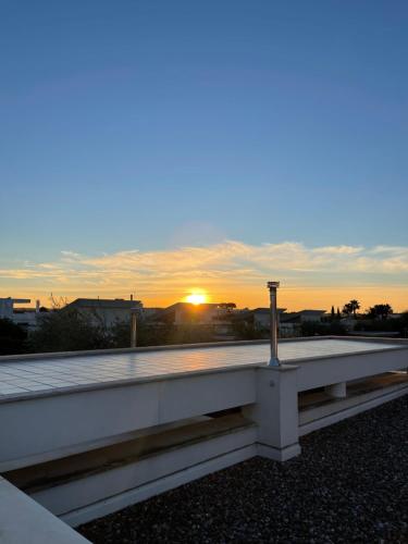 a view of the sunset from the roof of a building at Oasi della pace in Bisceglie
