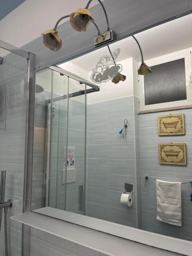 a shower with a glass door in a bathroom at Oasi della pace in Bisceglie