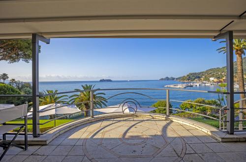 a view of the water from the balcony of a house at Hotel Continental in Santa Margherita Ligure