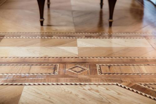 a wooden floor with a geometric design on it at Charming & Luxury Villa Como Lake in Como
