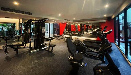 a gym with treadmills and cardio equipment in a building at Centara Life Hotel Bangkok Phra Nakhon in Bangkok