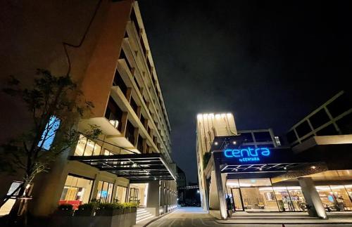 a building with a ceo sign on it at night at Centara Life Hotel Bangkok Phra Nakhon in Bangkok