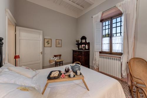 Ένα ή περισσότερα κρεβάτια σε δωμάτιο στο Villa Bonsi