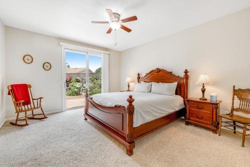 a bedroom with a large bed and a window at Wine Country Getaway in Windsor