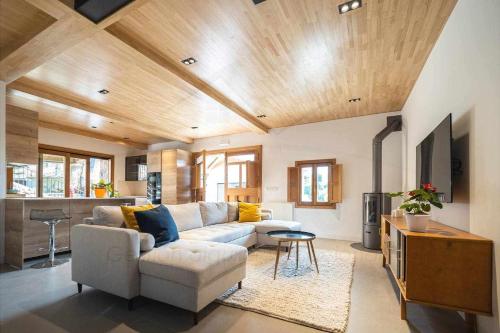 a living room with a couch and a table at La Quintana Berbes in Ribadesella