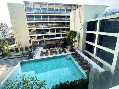 an overhead view of a swimming pool on a building at Centara Life Hotel Bangkok Phra Nakhon in Bangkok
