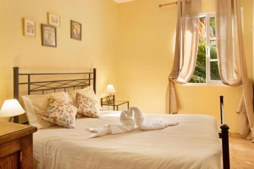 En eller flere senge i et værelse på Casa Cristina